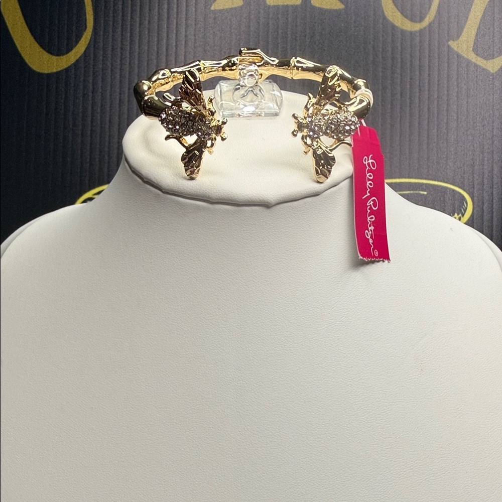 Lilly Pulitzer gold-tone hinged cuff bracelet with crystal-adorned bumblebees.